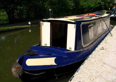 The Oxford Blue small canal boat Keble which is ideal for couples, moored at the College Cruisers Wharf in central Oxford.