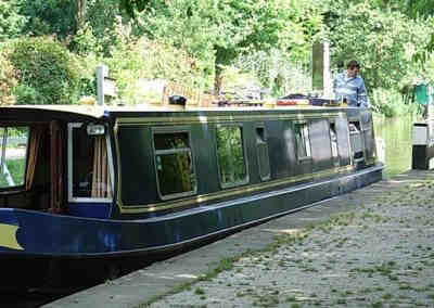 College Cruisers' canal boat Nuffield entering a lock on the Oxford Canal near its base in central Oxford.